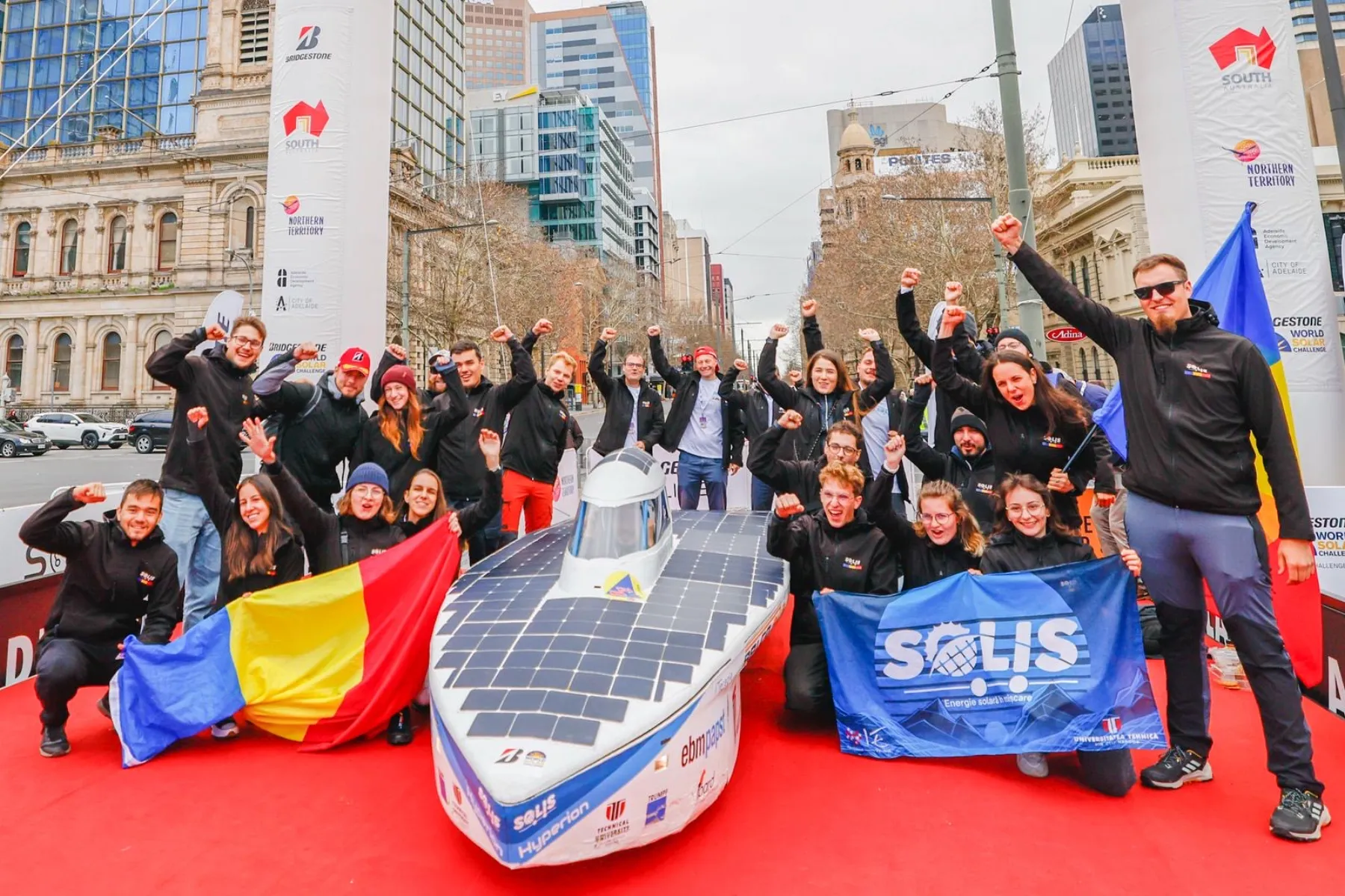 The Solis team celebrating at the Adelaide finish with the Romanian flag
